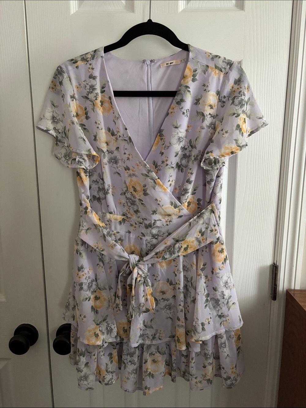 Francesca’s Mi Ami Lavender Floral Wrap Romper with Yellow Accents